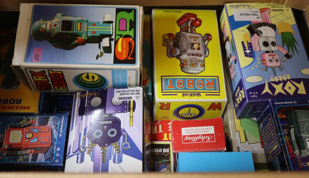 A collection of Chinese and Japanese-made collectors small clockwork robots,